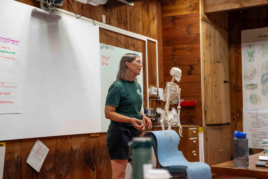 Woman presenting near a skeleton model