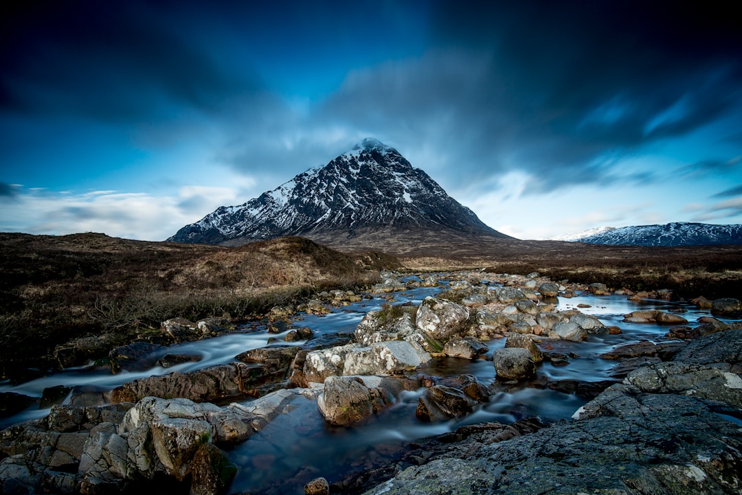 body of water at the foot of mountain